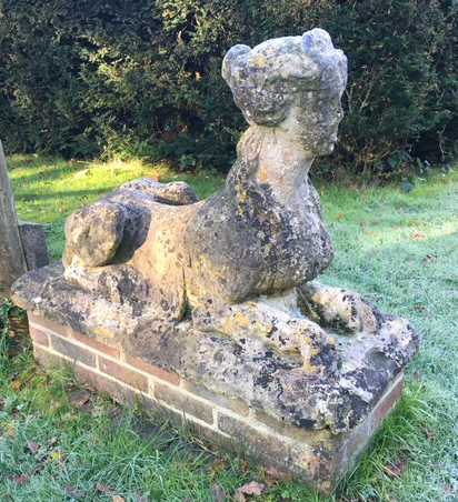 A pair of reconstituted stone models of sphinx, the bases 3ft 10in. x 1ft 7in., H.2ft 8in.